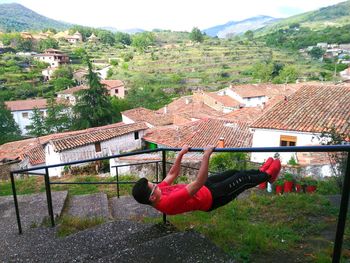 High angle view of man on woman against built structures