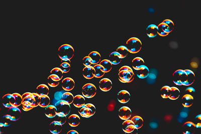 Close-up of bubbles against black background