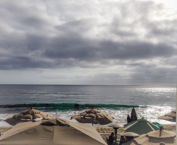 Scenic view of sea against cloudy sky