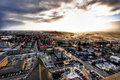 High angle view of city street against sky during sunset