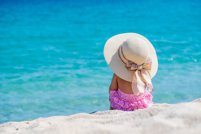 Rear view of a girl on the beach 