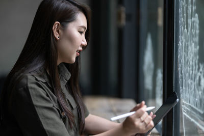 Young woman using mobile phone