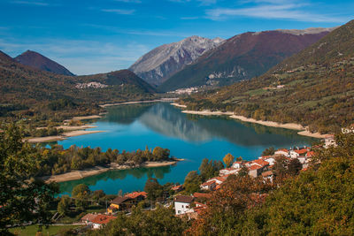 Scenic view of lake and mountains against sky