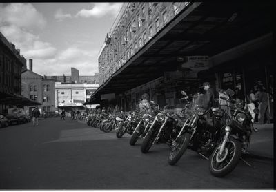 People riding motorcycle on street in city