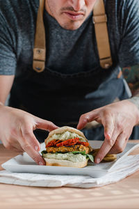 Midsection of man holding food