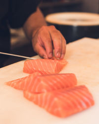 Salmon being cut on a table