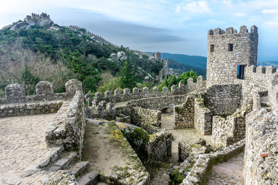 Old ruin building against cloudy sky