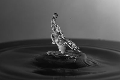 Close-up of drop falling in water