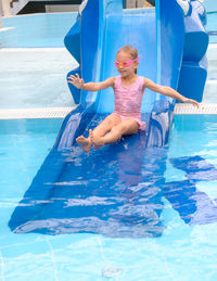 Portrait of boy swimming in pool