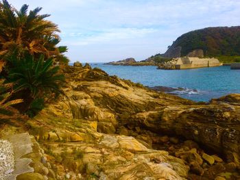 Scenic view of bay against sky