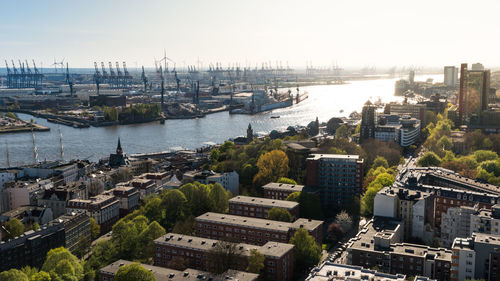 High angle view of river amidst buildings in city