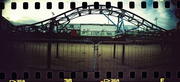 Train at railroad station against sky