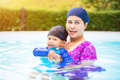 Portrait of happy boy in swimming pool