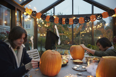 Pumpkin carving in greenhouse