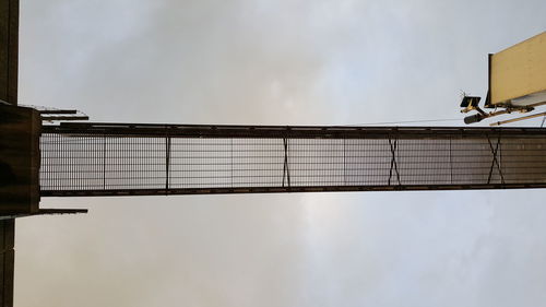 Low angle view of building against cloudy sky