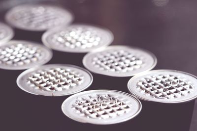 Close-up of coins on table against black background