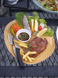 Thai style grilled pork neck with spicy dipping sauce .