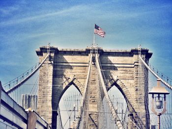 Low angle view of bridge against blue sky