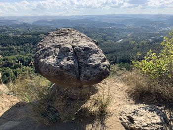 Scenic view of rocks on land against sky