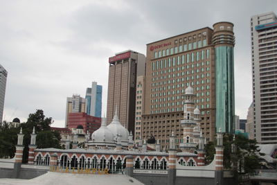 Modern buildings in city against sky