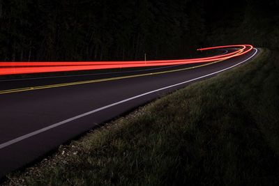 Light trails on road at night