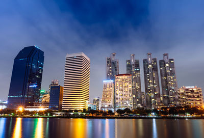 Panoramic view of illuminated buildings against sky at night