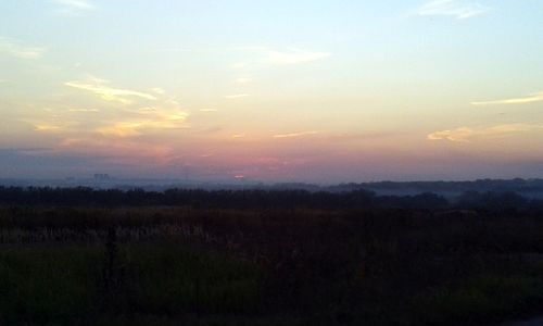 Scenic view of silhouette landscape against sky during sunset