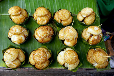 Sweet and savory grilled coconut-rice hotcakes,  asian dessert, thai, thailand, luang prabang, laos