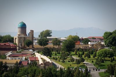 Buildings in town against clear sky