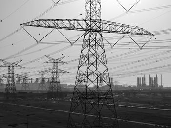 Electricity pylon against sky