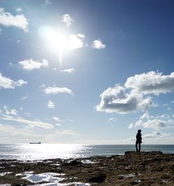 Woman standing on beach