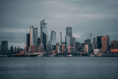 Sea with buildings in background
