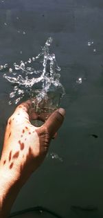 Midsection of person holding sea