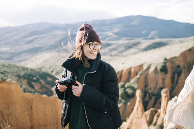 Young woman photographing