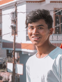 Portrait of young man standing outdoors