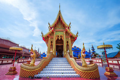 Temple outside building against sky