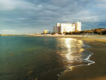 View of city against cloudy sky