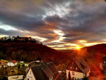 High angle shot of townscape against sky at sunset