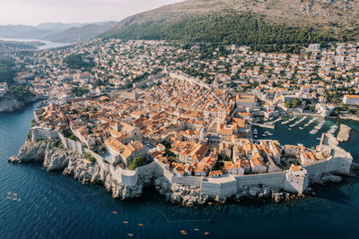 High angle view of townscape by sea