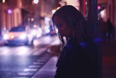 Young woman looking at night