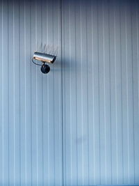 Security camera on patterned wall