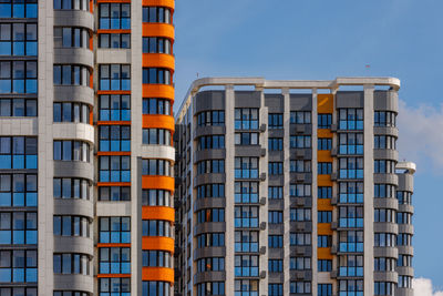 Low angle view of modern buildings against clear sky