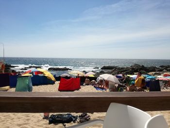 People relaxing on beach