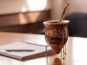 Close-up of container on table