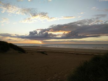 Scenic view of sea at sunset