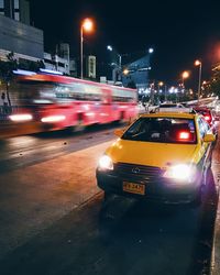 Traffic on road in city at night