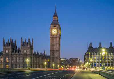 Illuminated city buildings at night