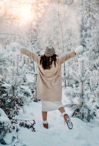 Woman standing in snow