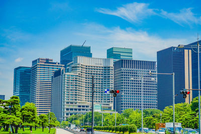 Modern buildings in city against sky