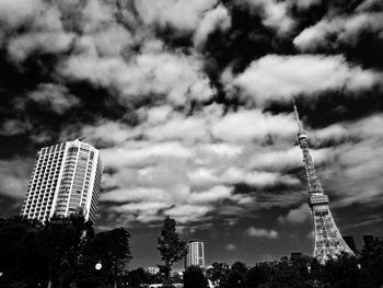 Low angle view of tower against cloudy sky